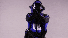 a man wearing a mask and headphones is standing with his arms outstretched