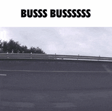 a black and white photo of a highway with the words buss bussssss on the bottom