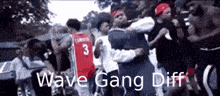 a group of young men are dancing in a street with the words wave gang diff written on the bottom .