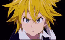a close up of a person 's face with a yellow hair and blue eyes .
