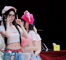 a girl wearing a crop top that says day star