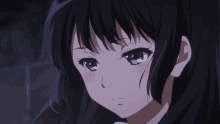a close up of a girl 's face with black hair and purple eyes
