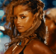 a close up of a woman wearing a choker and earrings