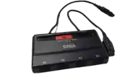 a sega video game controller with a cord attached to it .