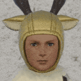 a man wearing a deer costume with the letter h written on his forehead