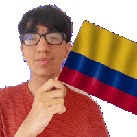 a man wearing glasses is holding a small colombian flag