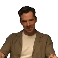 a man in a brown jacket and white shirt is making a face