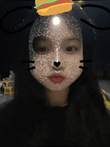 a girl with a cat face and a hamburger on top of her head