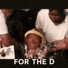 a group of people are standing around a woman with the words for the d written on the bottom .