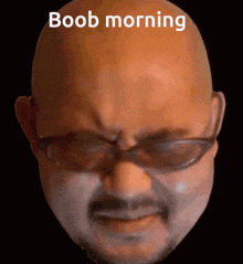 a bald man with glasses and a mustache has the words boob morning above his head
