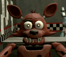 foxy from five nights at freddy 's is sitting at a table with bonnie
