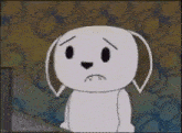 a cartoon dog with a sad face is sitting in front of a computer monitor .