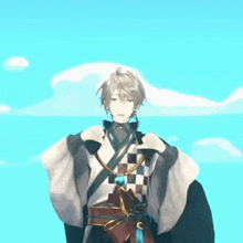 a man in a kimono stands in front of a blue sky with his hands in the air
