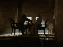 a man pours something into a woman 's cup