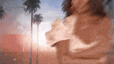a blurry picture of a woman in front of palm trees with the words real housewives on the bottom right