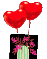 two red heart shaped balloons that say happy
