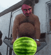 a man without a shirt is holding a watermelon in front of his butt