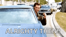 a man is driving a car with a broken windshield and the words `` alrighty then '' written on the bottom .