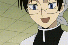 a close up of a person wearing glasses and a black and white shirt .