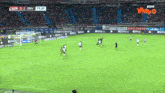 a soccer game is being played in a stadium with ads for wplay.co