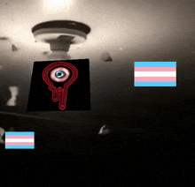 a picture of a bloody eye with a transgender flag behind it