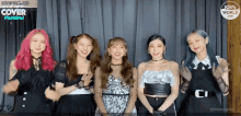 a group of girls are posing for a picture in front of a curtain that says kbs world cover festival