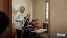 a group of people are in a room with showtime written on the bottom