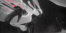 a black and white image of a person holding a gun