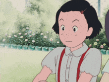 a girl with a cherry in her hair is looking at something