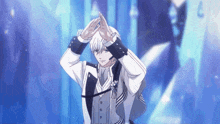 a man in a suit and tie is making a heart shape with his hands