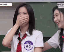 a girl with the name itzy covering her mouth