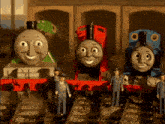 a group of toy trains are lined up on a track