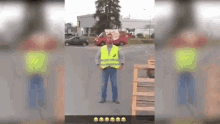 a man wearing a yellow safety vest is standing on the street .