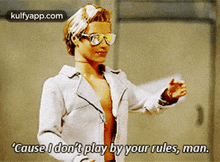 a barbie doll is wearing sunglasses and a white jacket and says " cause i don t play by your rules , man