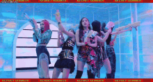 a group of girls are dancing in a room with a sign that says secret number