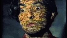 a close up of a person 's face with a painting on it