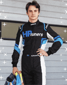 a man wearing a racing suit that says hptuners