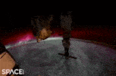 a space.com advertisement shows the aurora borealis