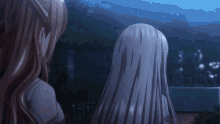 two women with long hair are looking at something