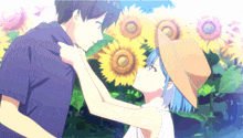 a man and a girl are standing in front of sunflowers