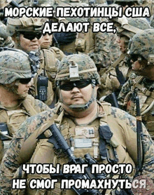 a group of soldiers are standing in a line and one of them is wearing sunglasses and a helmet .