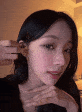 a close up of a woman wearing earrings