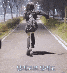a girl with a backpack is running down a street with korean writing on the side
