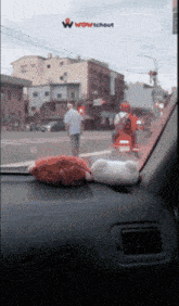 a car dashboard with a sticker that says wow tchout on it
