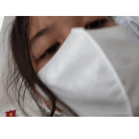 a close up of a person wearing a mask