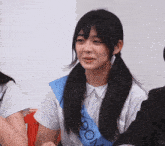 a girl wearing a sash that says dom