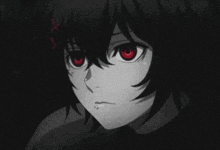 a close up of a person 's face with red eyes in a black and white photo .