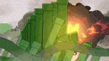 a bunch of green tubes are stacked on top of each other with a fire behind them