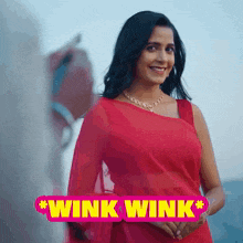 a woman in a red dress with the words wink wink