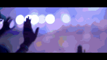 a blurry image of a person 's hands reaching up towards the sky